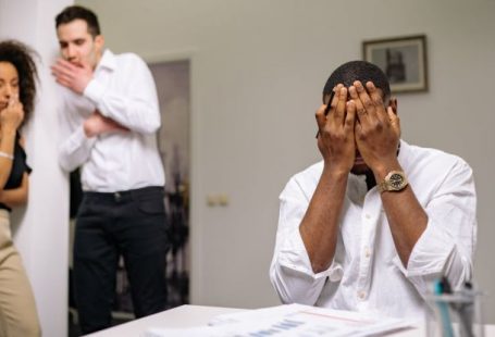 Conflict Management - Man in White Dress Shirt Covering His Face