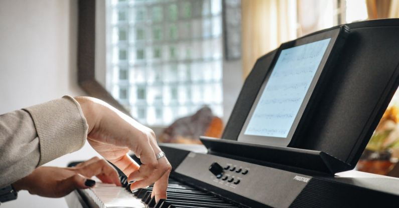 Continuous Learning - A person playing on an electronic keyboard