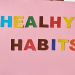 Entrepreneurial Habits - Person Holding a Pink Poster with Message