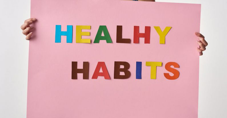 Entrepreneurial Habits - Person Holding a Pink Poster with Message