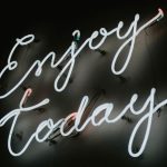 Staying Motivated - Neon Sign in a Black Background